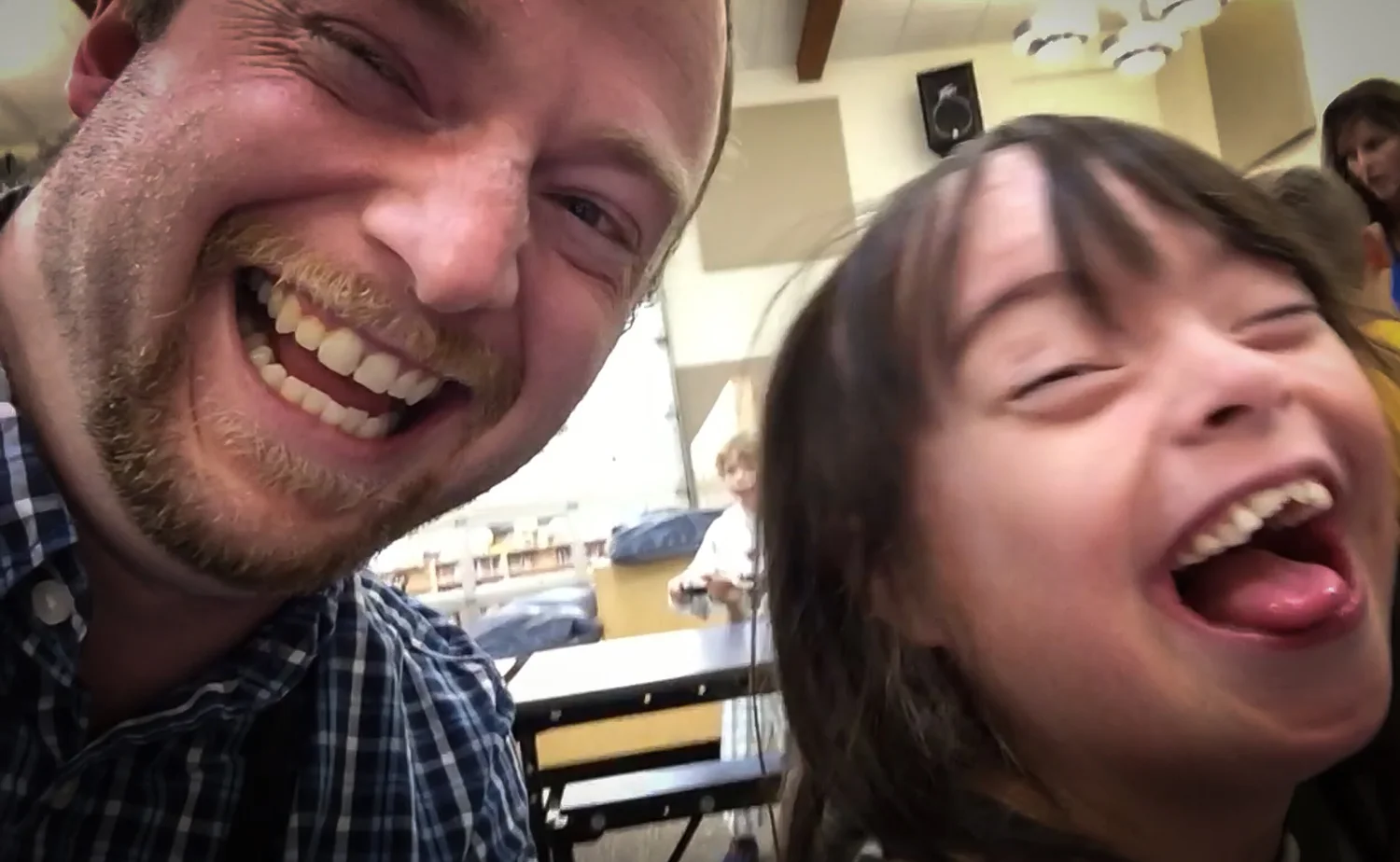 Man and young woman laughing together for a selfie