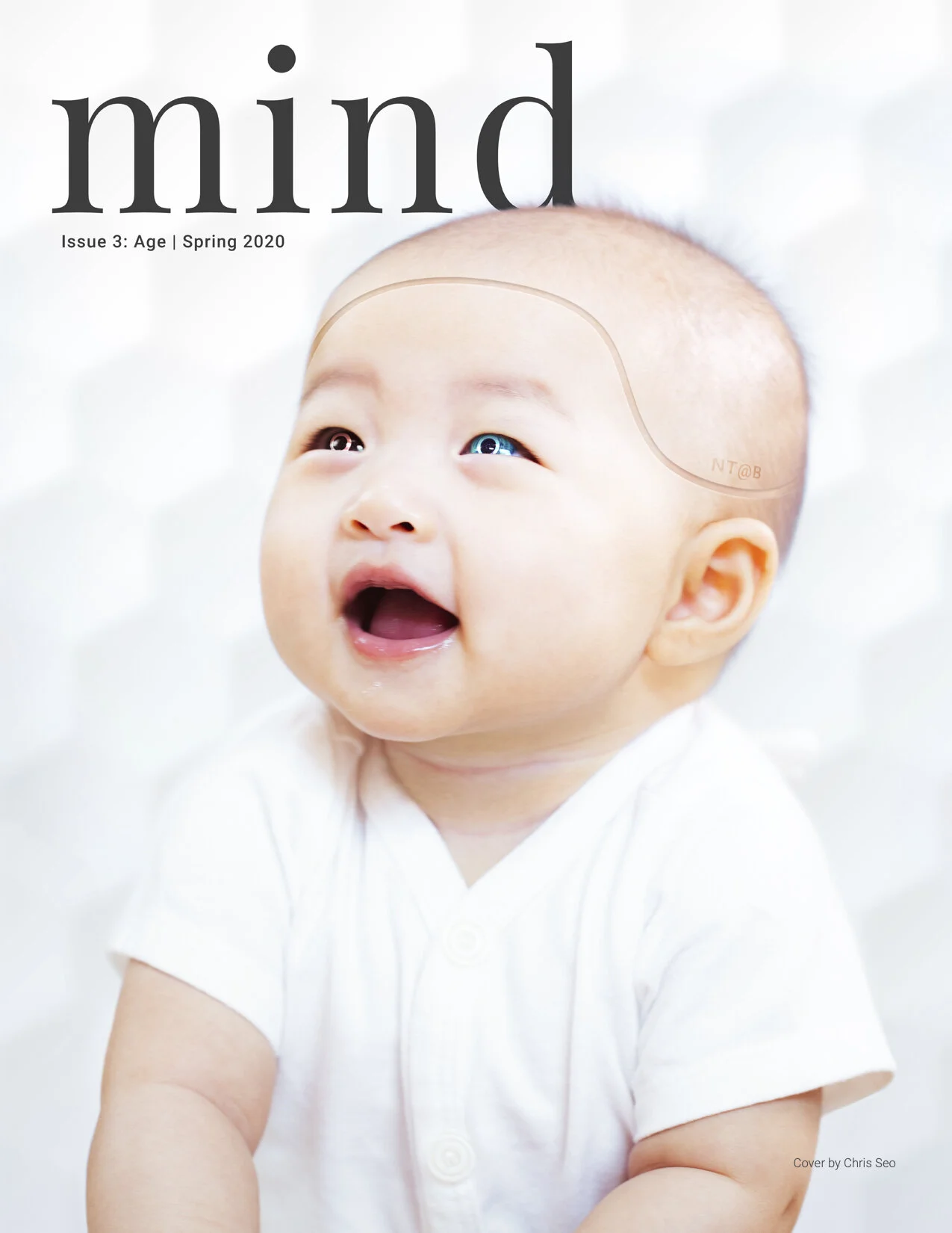 MIND magazine Issue 3 cover featuring a smiling baby